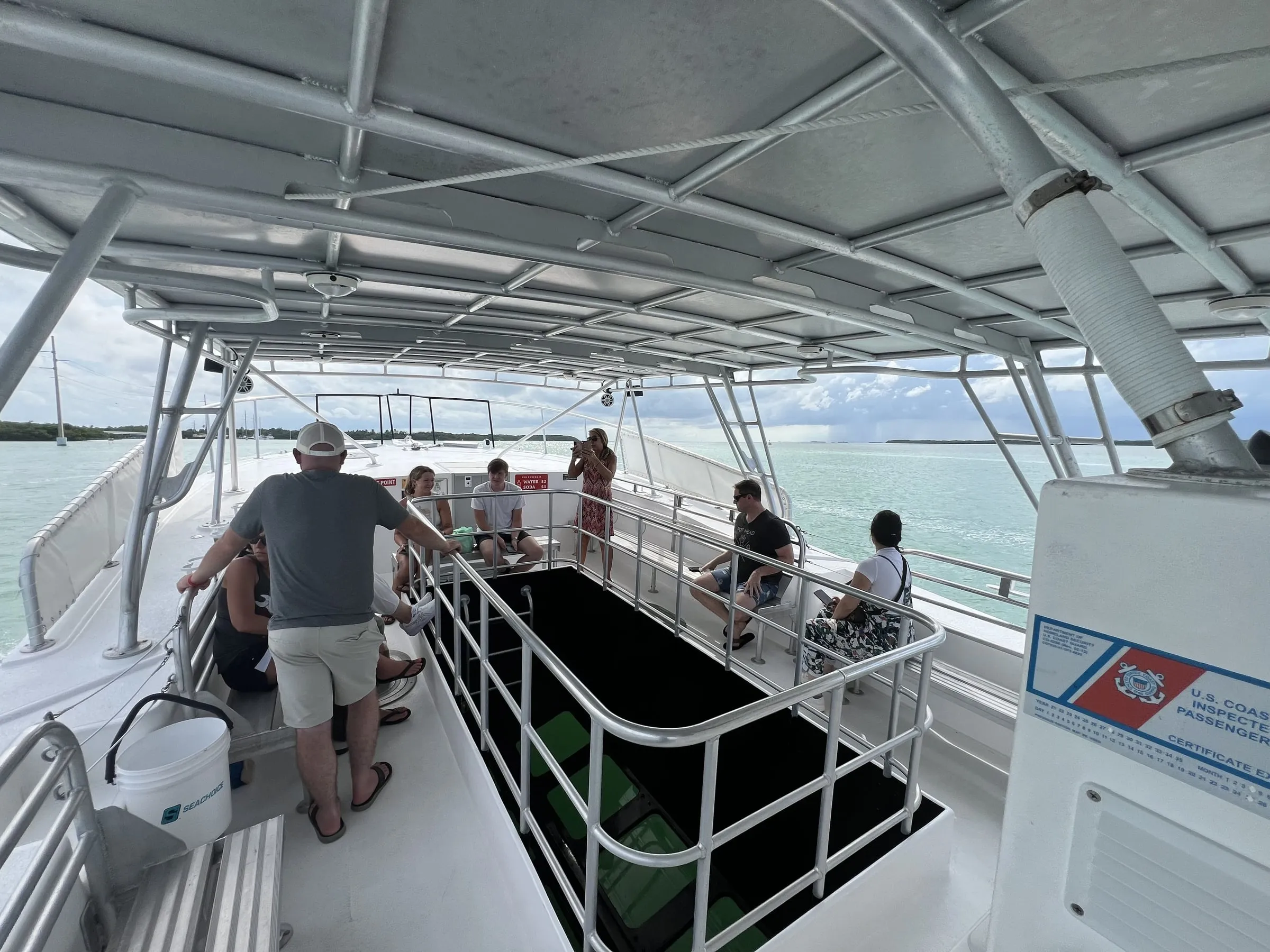 The shaded upper deck with seating around the railed viewing well